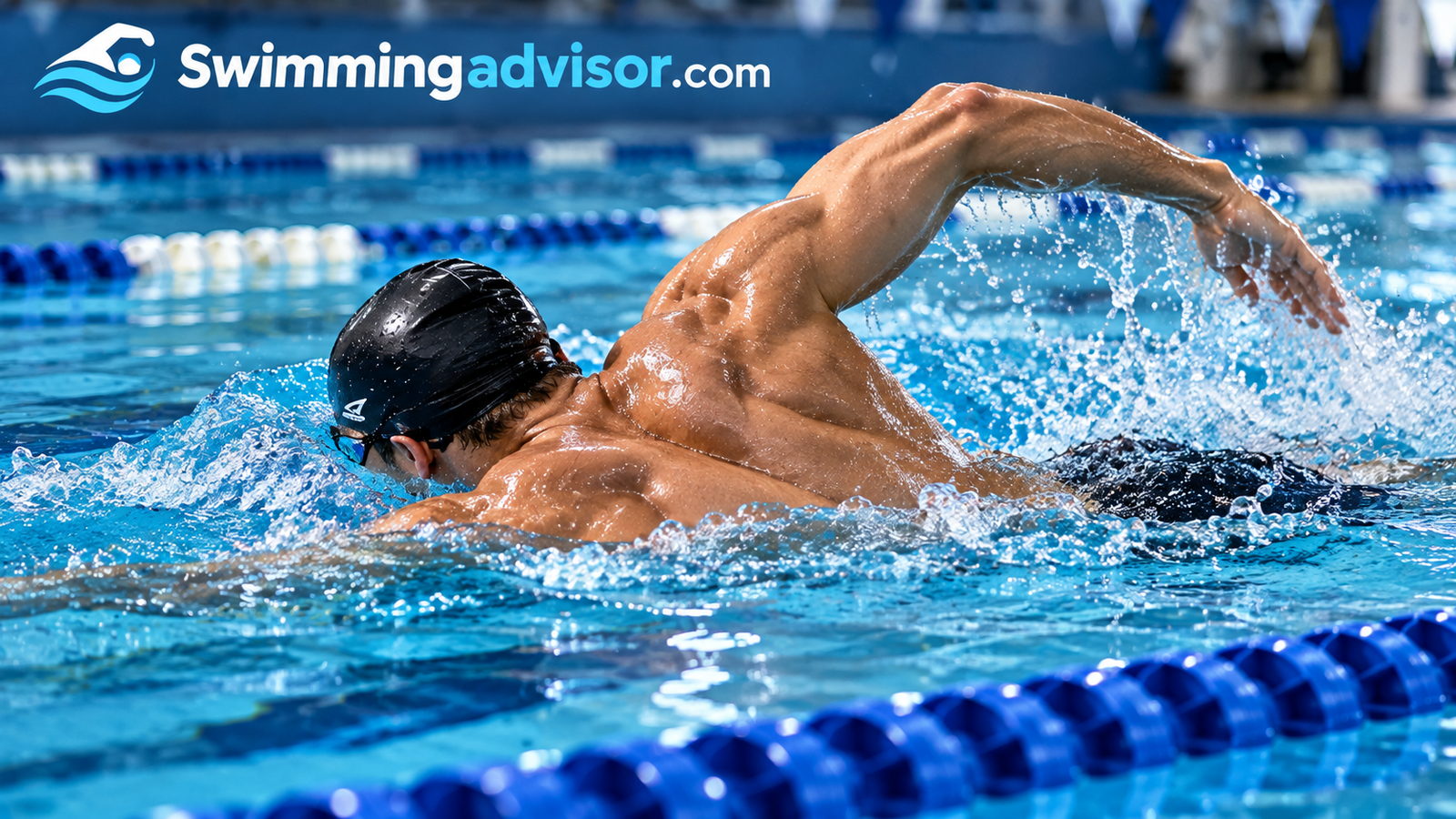 Swimmer pulling through the water in a lap pool, showing strong shoulders and back muscles
