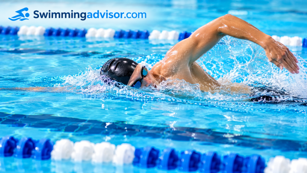 Swimmer using smooth freestyle technique in a clear lane of a pool